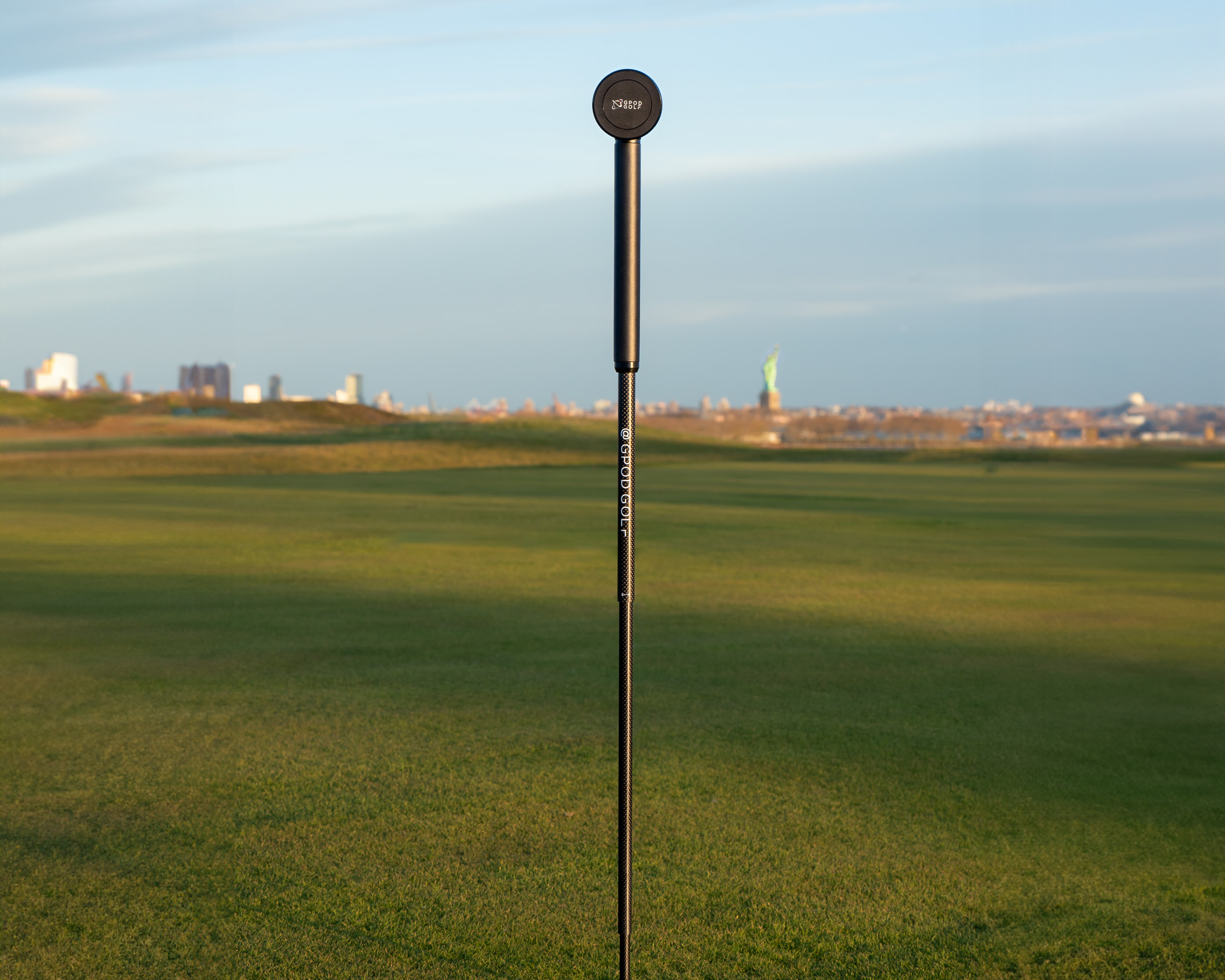 GPOD X Magnetic monopod on the range of a golf course for filming golf swings