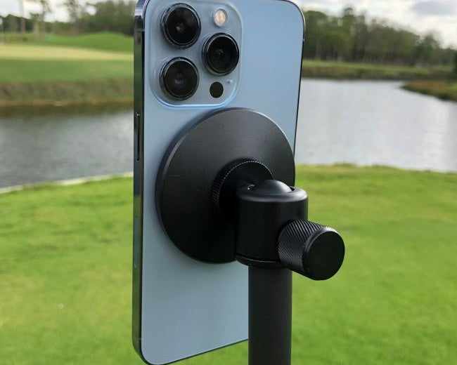 Rear view of Iphone 13 Pro attached to MagSafe magnetic head of Golf Pod GPOD Carbon fiber